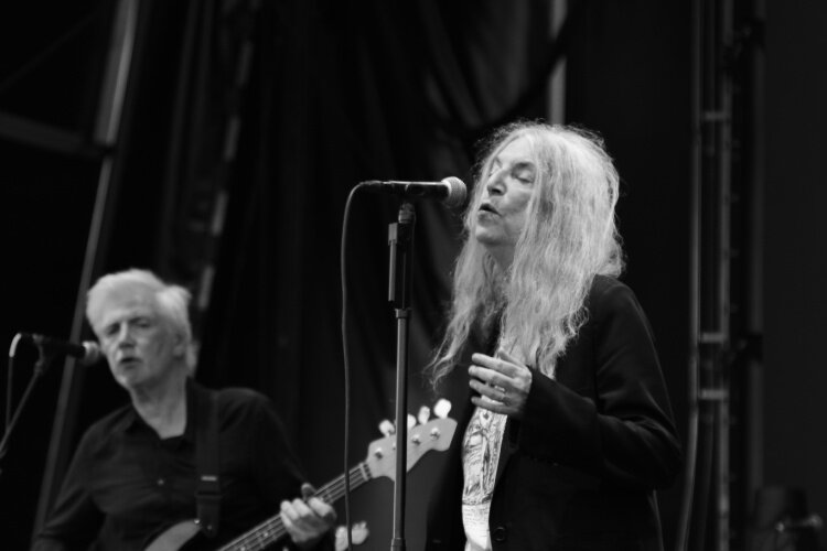Patti Smith sang several of her classic tunes backed by her longtime band, including Tony Shanahan on bass (left) at Homecoming Friday night.