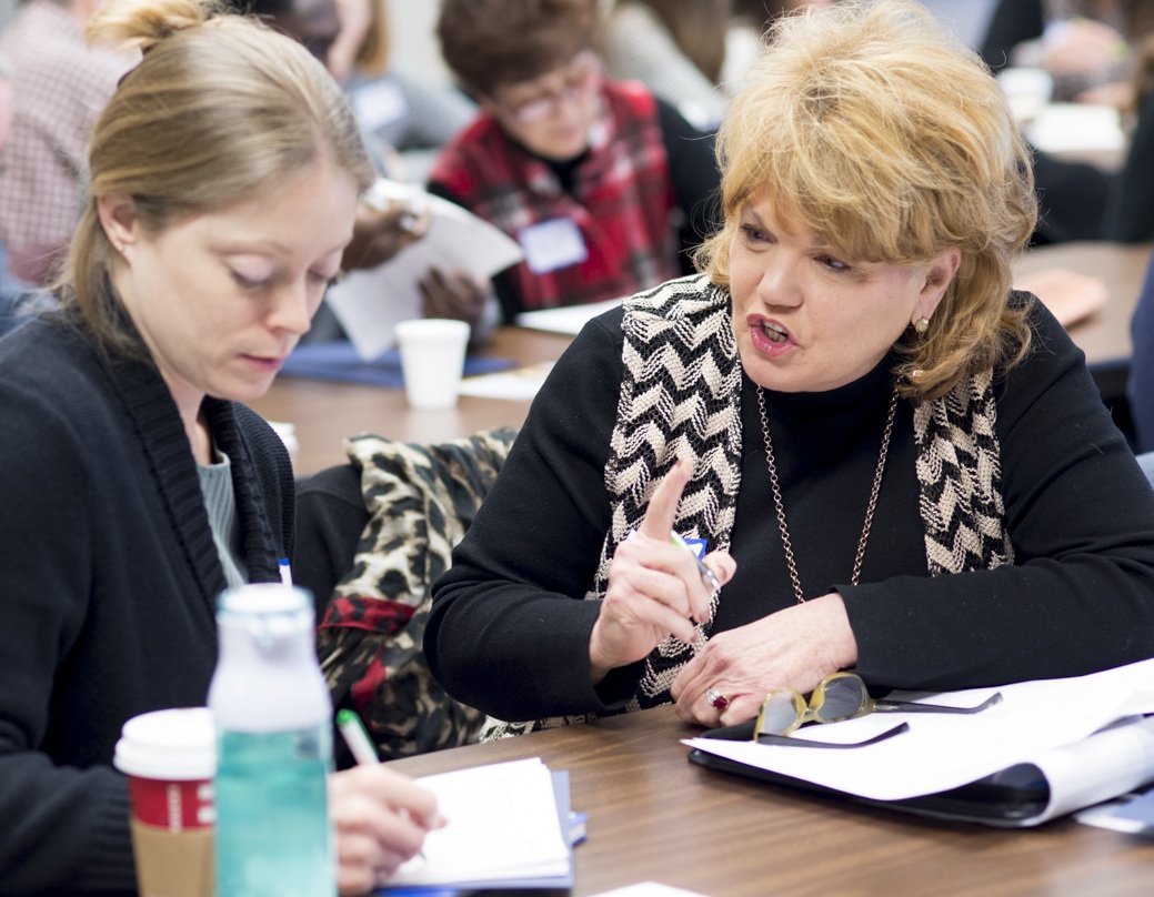 Rayma Waters (right) and Sarah Mangan of Higher Education Mentoring Initiative on Jan. 10