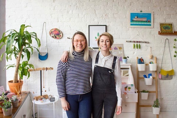 Suzy Strachan (left) and Brittney Braemer, co-owners of stationery shop Handzy in Covington.