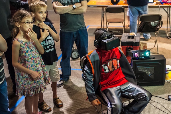 Kids try virtual reality equipment at 2014 Maker Faire