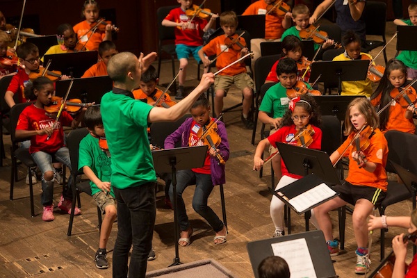 Eddie Kwon conducts the MyCincinnati youth orchestra, based in Price Hill 