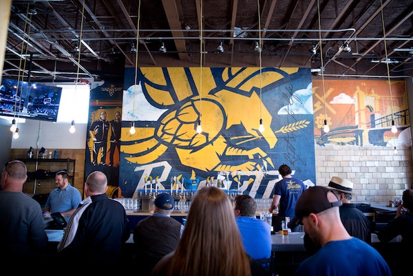 Keith Neltner's mural is a focal point of Braxton Brewing's taproom