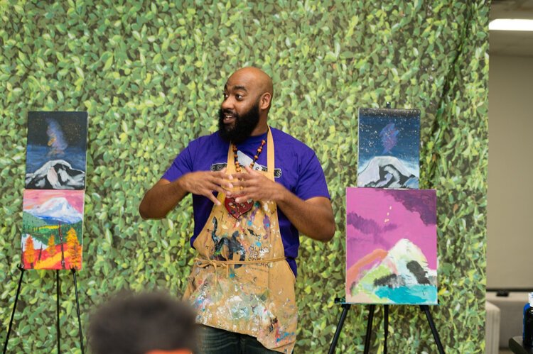 Artist Christian Drye mentors West End youth in the Guiding Light program.