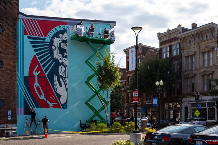 ArtWorks artists install the permanent Shepard Fairey mural at 1412 Vine Street in Over-the-Rhine.