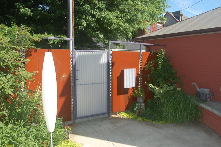 Reimagined outdoor space with mailbox gate from Chris Kepes, AIA, Kepes Architecture..