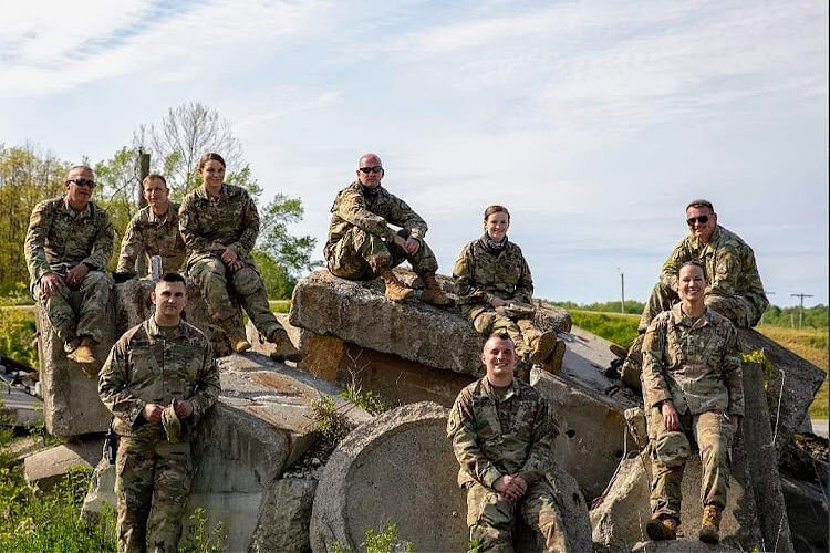 Christopher Jarvis (R, back row) served in the U.S. Army and now works at Atlas Air Worldwide. He helps recruit veterans through the U.S. Dept. of Defense’s SkillBridge program.