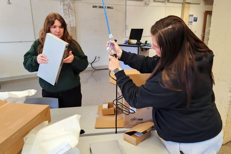 Students in the Computer Information Technology Program at Gateway Community and Technical College unbox and test new equipment purchased by the department.