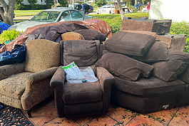 A pile of flooded, ruined furniture in front of Dave Scheiber's Snell Isle area home.