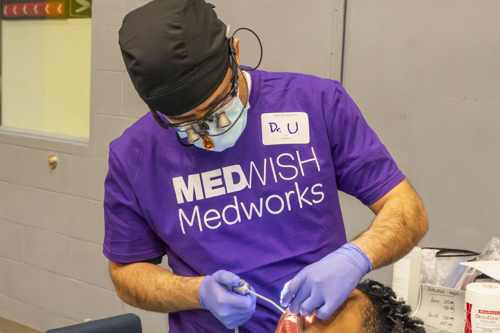 A MedWish Medworks volunteer doctor works on a patient at the Cuyahoga County Juvenile Detention Center.