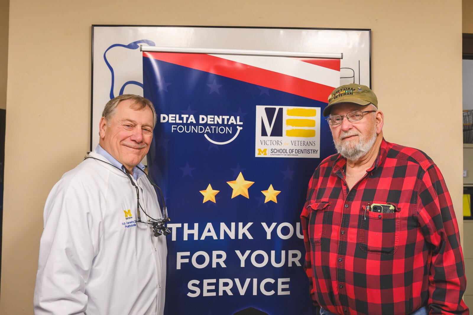 Dr. Howard Hamerink and patient Barry Teagan at the VINA Community Dental Clinic in Brighton.