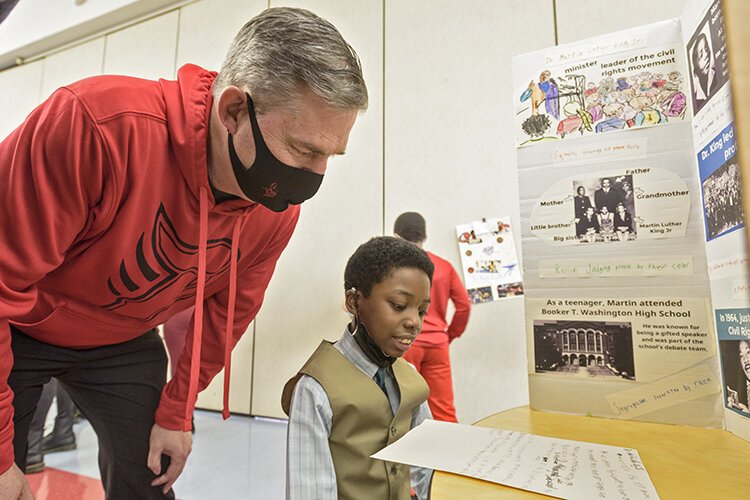 Superintendent Tom Burton and student Eric Wells